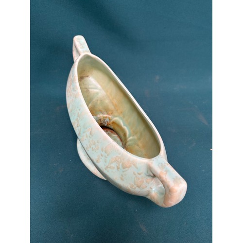 481 - A 1950’s boat shaped vase in mottled green by Price Brothers