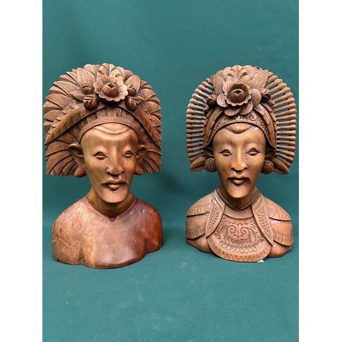 257 - Pair of late 20th Century Indonesian carved hardwood busts of ladies in traditional headdress. 37cm ... 