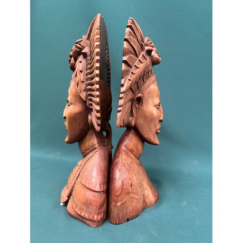 257 - Pair of late 20th Century Indonesian carved hardwood busts of ladies in traditional headdress. 37cm ... 