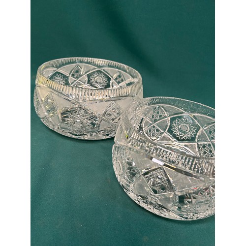 213 - A graduated pair of very heavy cut glass lead crystal bowls - the largest  24cm dia