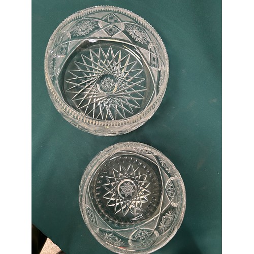 213 - A graduated pair of very heavy cut glass lead crystal bowls - the largest  24cm dia