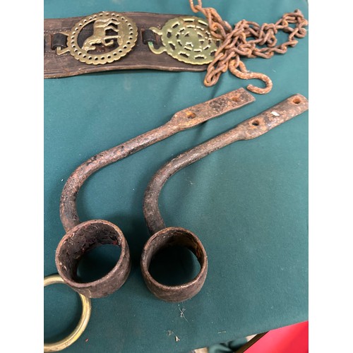 414 - Three antique leather cart straps with horse brasses, a wooden dairy maid’s yoke, carriage lamp brac... 