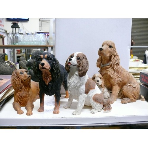 387 - 4 DOG FIGURINES TO INCLUDE COUNTRY ARTISTS AND DANBURY MINT