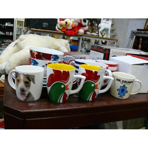 396 - COLLECTION OF MUGS AND DINNERWARE TO INCLUDE KELLOGS, DOGS, MR MEN ETC