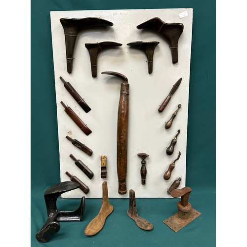 384 - Display board with collection of vintage cobblers and leather workers tools, shoe lasts etc and also... 