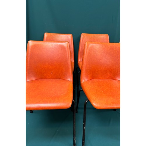 491 - Set of four 1970's stacking chairs upholstered in original burnt orange vinyl fabric - one has paint... 