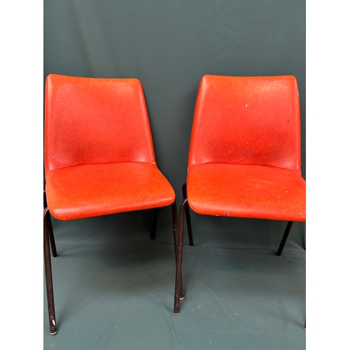 491 - Set of four 1970's stacking chairs upholstered in original burnt orange vinyl fabric - one has paint... 