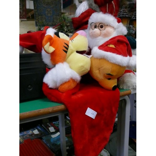 420 - A PLUSH SANTA PLUS WINNIE THE POOH AND TIGGER STOCKINGS