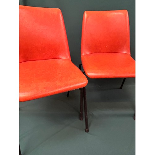 491 - Set of four 1970's stacking chairs upholstered in original burnt orange vinyl fabric - one has paint... 