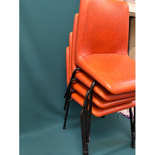 491 - Set of four 1970's stacking chairs upholstered in original burnt orange vinyl fabric - one has paint... 