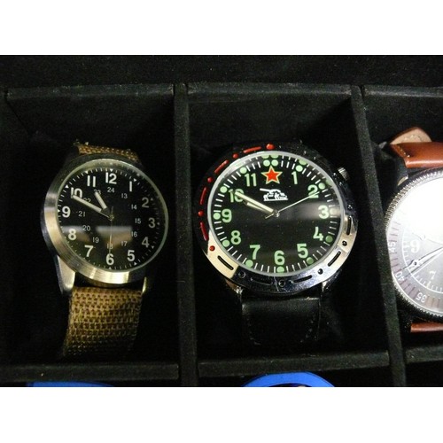 35 - A WATCH DISPLAY BOX WITH 23 NEW OR NEARLY NEW WATCHES A LOT OF WHICH ARE WORKING FINE, REFER TO PHOT... 