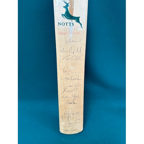 331 - A cricket bat signed by 17 of the West Indian team - Sherwin Campbell, Chris Gayle etc - 1990's play... 