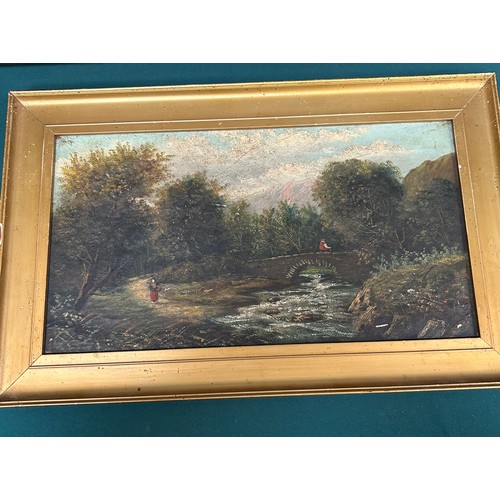 160 - A 19th Century Oil Painting on canvas of a river scene with a figure on a bridge. Inscribed in penci... 