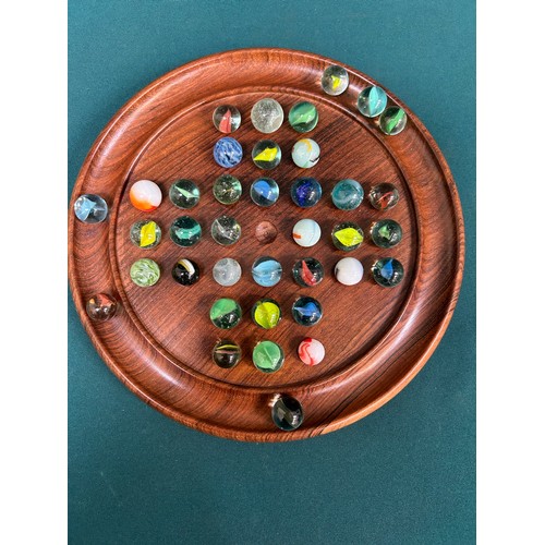 186 - A turned walnut solitaire board with collection of vintage & antique glass marbles