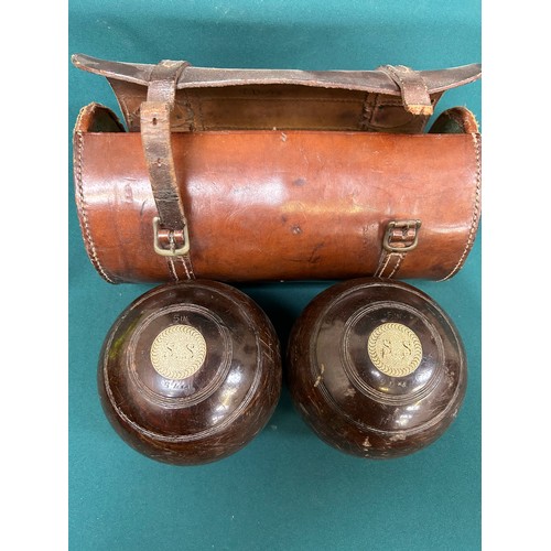 187 - A good pair of early 20th Century Jaques & Son London Lignum Vitae lawn bowls in original leather ba... 