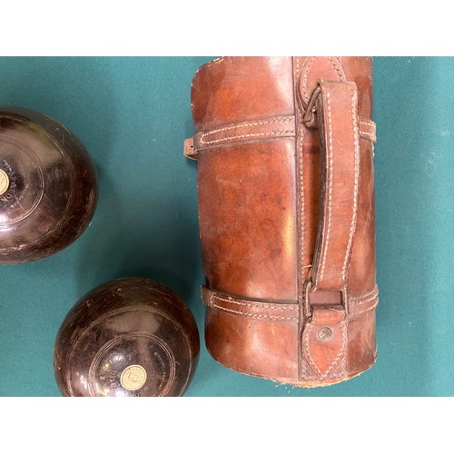 187 - A good pair of early 20th Century Jaques & Son London Lignum Vitae lawn bowls in original leather ba... 