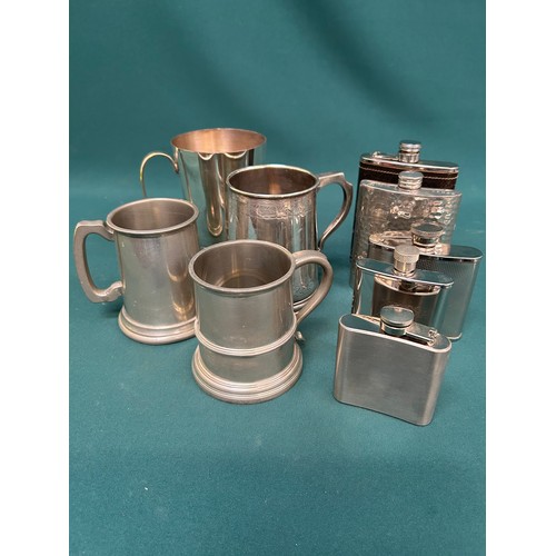 295 - Five silver plated spirit flasks, two silver plated tankards and two pewter tankards