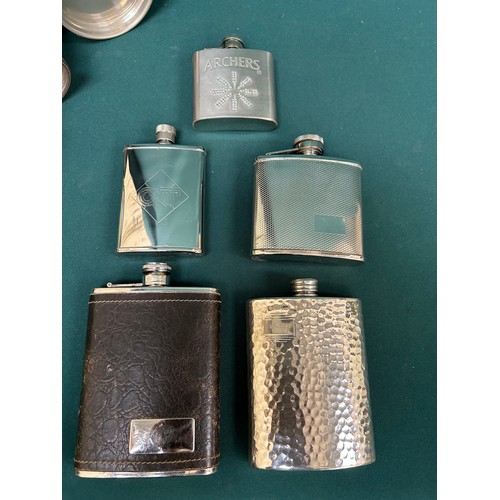 295 - Five silver plated spirit flasks, two silver plated tankards and two pewter tankards