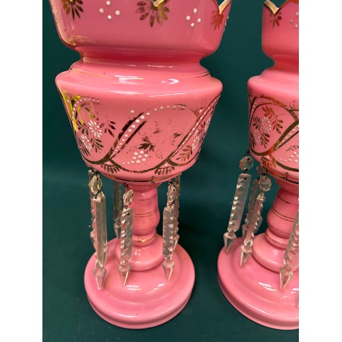 205 - A pair of Victorian pink glass lustres in very good condition. 2 drops missing. One has hairline cra... 