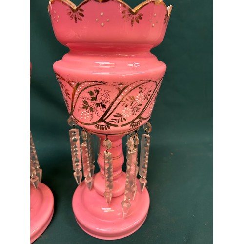 205 - A pair of Victorian pink glass lustres in very good condition. 2 drops missing. One has hairline cra... 