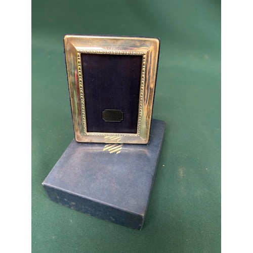 20 - A Sterling Silver photograph frame with the millenium hallmark in original box. Sheffield 2000, Carr... 