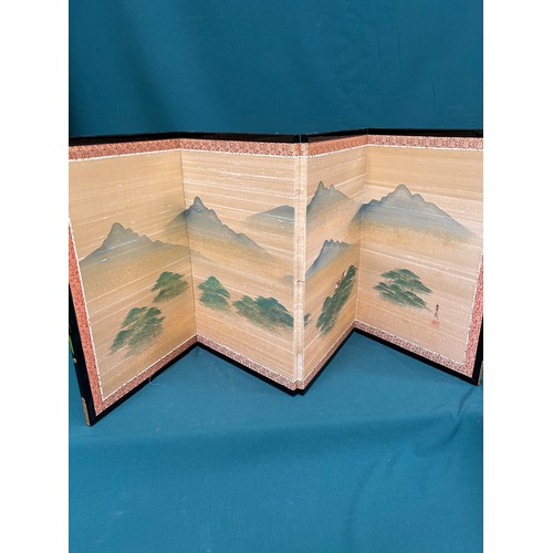 255 - Decorative oriental four panel table screen handpainted with a mountain landscape