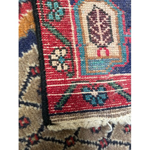 287 - Large Vintage Persian Hamadan carpet with central medallion in reds and blue against a paler field. ... 