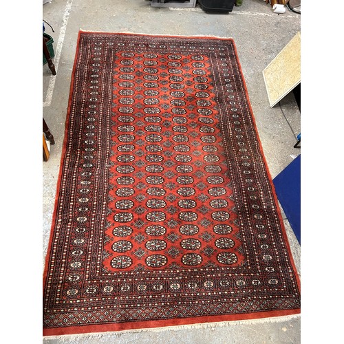 288 - Large 20th Century Bokhara hand knotted carpet in russet, sand and pale blue colours. 150cm x 250cm