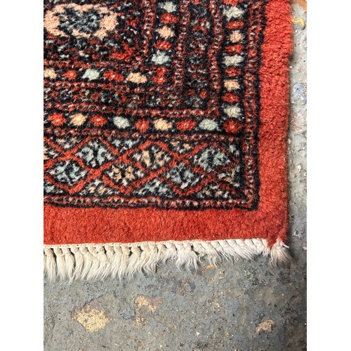 288 - Large 20th Century Bokhara hand knotted carpet in russet, sand and pale blue colours. 150cm x 250cm