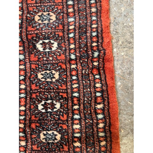 288 - Large 20th Century Bokhara hand knotted carpet in russet, sand and pale blue colours. 150cm x 250cm