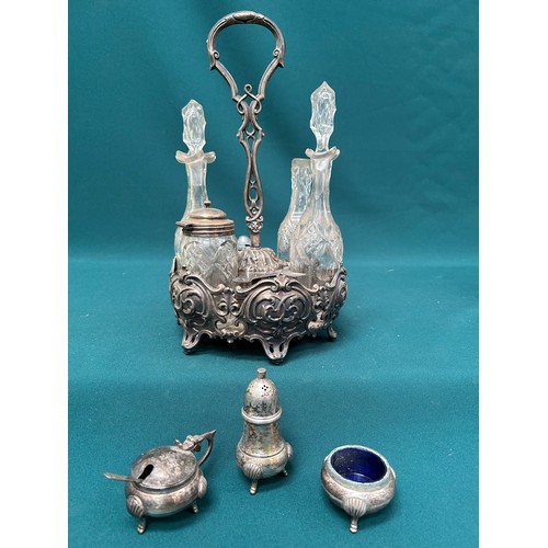 289 - A Victorian part condiment set on plated stand and a 3 piece set with blue glass liners - losses and... 