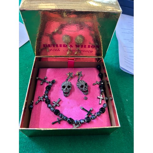 6 - BUTLER & WILSON DESIGNER JEWELLERY PAIR OF SKULL & CROSS EARRINGS AND A BLACK BEAD BRACELET WITH DIA... 