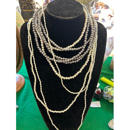 20 - SIX STRANDS OF SIMULATED PEARLS - DIFFERENT SIZES AND LENGTHS - CAN BE WORN INDIVIDUALLY OR TOGETHER