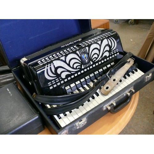 57 - A VERY NICE GALOTTA PIANO ACCORDIAN IN A CASE