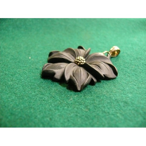 25 - AN UNUSUAL BLACK JASPER FLOWER PENDANT WITH STERLING SILVER LOOP  - 5CM DIA