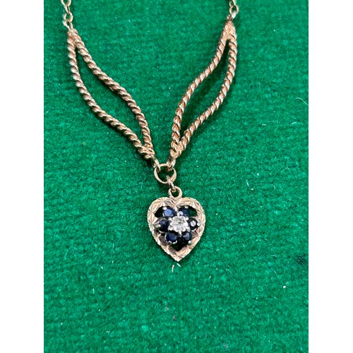 39 - A 9CT GOLD NECKLACE WITH SAPPHIRE HEART PENDANT - UNUSUAL DOUBLE LEAF DESIGN FOR THE PENDANT FITTING... 