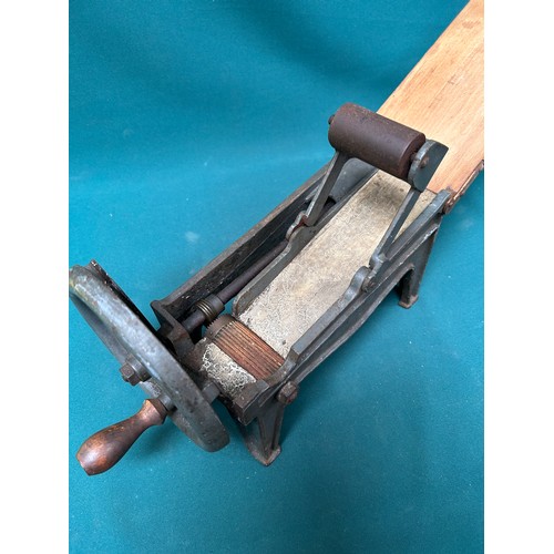 406 - An early 20th Century German made cast iron tobacco cutter or shredder