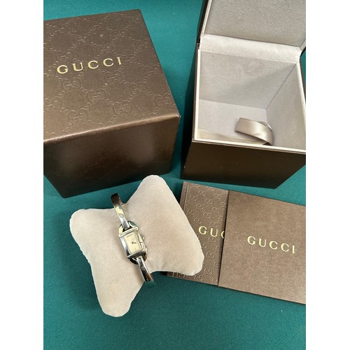 69A - A stylish Gucci ladies wrist watch with original box and booklet. Recently serviced & working