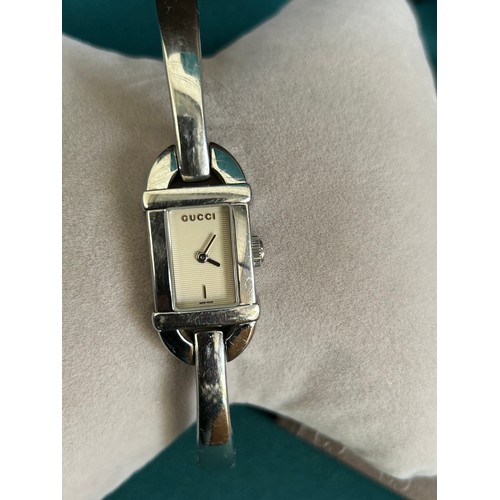 69A - A stylish Gucci ladies wrist watch with original box and booklet. Recently serviced & working