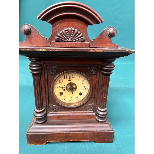 276 - A Victorian mahogany cased mantel clock - the enamel and gilt brass dial with arabic numerals - with... 