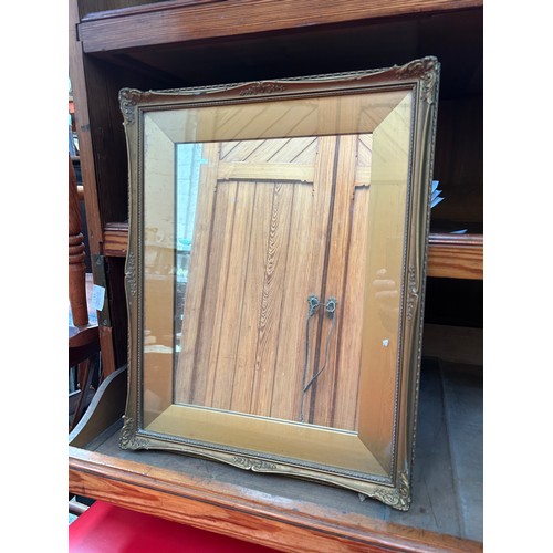 278 - Wall  mirror in an ornate gilt frame with wide slip frame - 50cm x 40cm