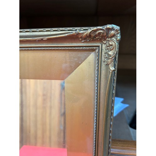 278 - Wall  mirror in an ornate gilt frame with wide slip frame - 50cm x 40cm