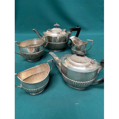 298 - A silver plated 3 piece tea service in the Georgian style and another 2 piece with teapot & sugar bo... 