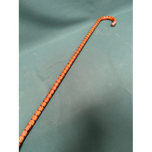 323 - A Victorian carved bamboo walking stick with silver tip to handle, London hallmark