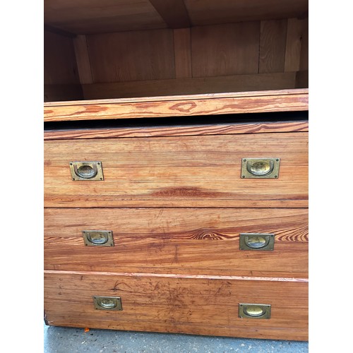 483 - Large Victorian pitch pine linen press cupboard with four sliding linen shelves and 3 drawers below ... 