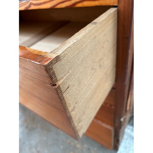 483 - Large Victorian pitch pine linen press cupboard with four sliding linen shelves and 3 drawers below ... 