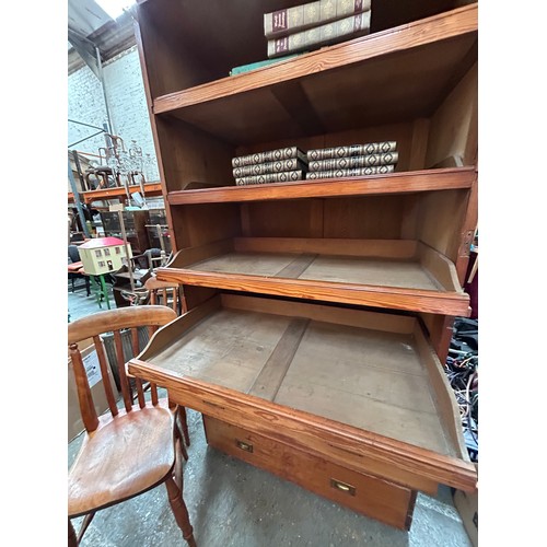 483 - Large Victorian pitch pine linen press cupboard with four sliding linen shelves and 3 drawers below ... 