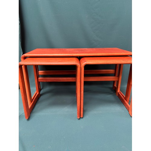 503 - A circa 1970's bentwood teak nest of 3 tables with label on larger piece 