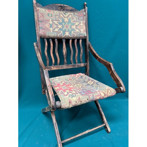 523 - A late Victorian Folding chair with tapestry type seat and back. Needs repair to bottom stretcher, s... 