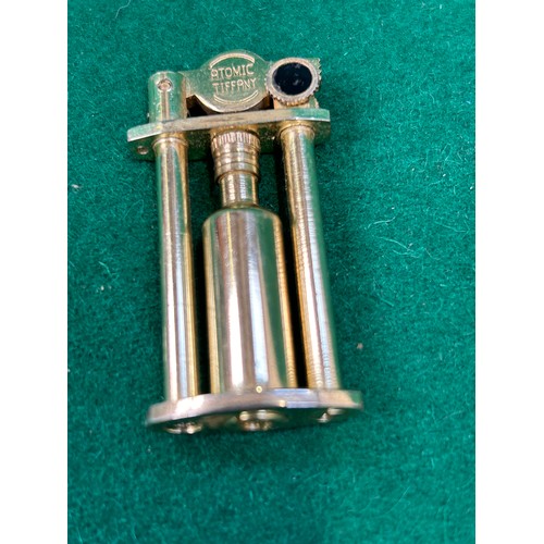 117F - An Atomic Tiffany lighter and a Colibri table lighter with Webb Corbett crystal base